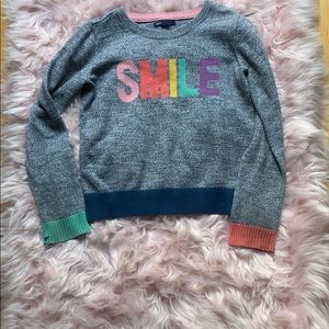 Gap kids sweater with Smile in the middle.